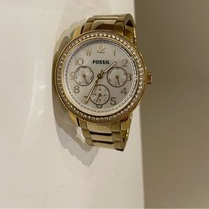 Women’s gold fossil watch with crystal halo
